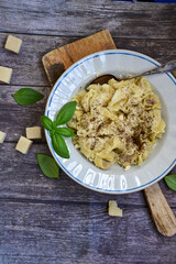 Home made Italian   Tortelloni  bolognese with  parmesan cheese filled with  beef ,  tomato and mozzarella cheese, decorated with fresh basil