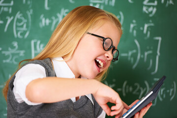 child, student and calculator by chalkboard for happy education, learning and problem solving or...
