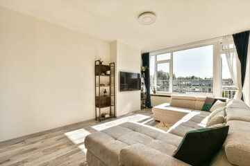 a living room with two couches and a flat screen tv on the wall in the room is very clean