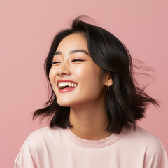Fototapeta premium portrait of a woman, pink t shirt portrait of a smiling girl in pink background studio space 