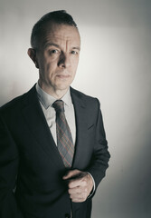 Man 50s in business suit shirt tie