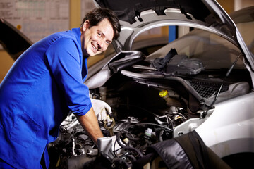 Fototapeta na wymiar Portrait, happy man and mechanic check oil on engine of car, repair and maintenance. Face, smile and technician on motor vehicle, fixing transport or inspection at auto service workshop or business