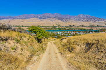 scenic view of Korzhantau ridge, Mingbulak peak and Chirchiq river from Karankul village (Tashkent region, Uzbekistan)