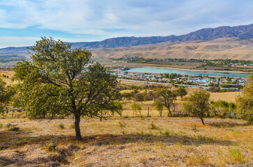 Fototapeta na wymiar scenic view of Chirchiq river valley and Korzhantau ridge from Karanul village (Tashkent region, Uzbekistan)