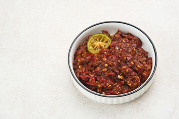 Sambel or Sambal Terasi is traditional food which is popular in Indonesia. Made from tomatoes, chilies, salt, sugar, garlic, shallots and shrimp paste (terasi).
