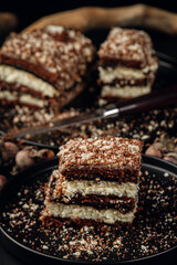 Slice of homemade cake on a black plate