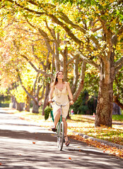 Bicycle, woman and happy for fitness in nature, vacation exercise and eco friendly central park...