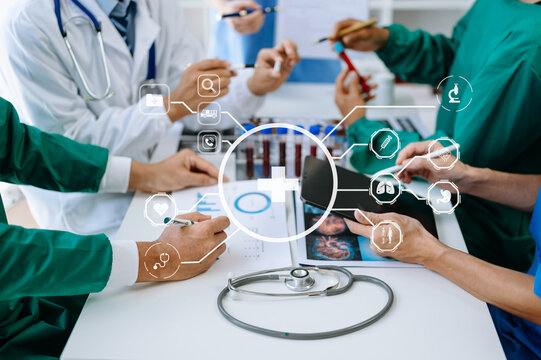 Medical technology network team meeting concept. Doctor hand working with smart phone modern digital tablet and laptop computer with graphics chart interface, with virtual icon diagram.