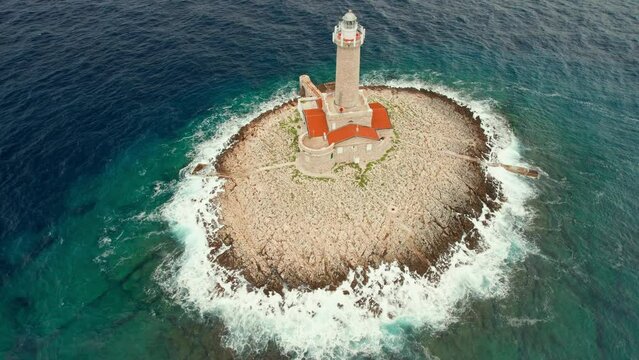 Lighthouse Porer on a small rocky island in Adriatic sea in Croatia
