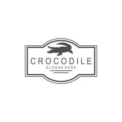 Fototapeten vector image of a black crocodile animal, on a white background. © Slamet
