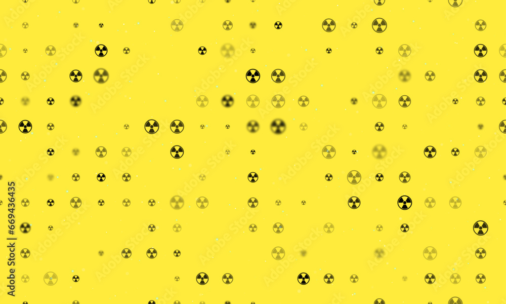 Poster seamless background pattern of evenly spaced black radiation symbols of different sizes and opacity.
