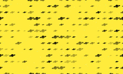 Seamless background pattern of evenly spaced black saturn symbols of different sizes and opacity. Vector illustration on yellow background with stars