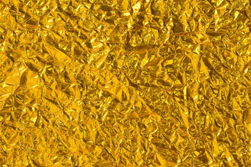 crumpled gold foil texture background