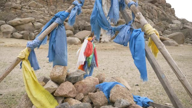 An Ovoo in the Mongolia steppes. A traditional monument of nomads originally linked to the cult of mountains and sky. Mongolia - 04 25 2023. 