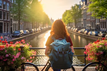 Young female tourist backpacker travelling aroung the world. Travel Destination - Amsterdam, Netherlands.