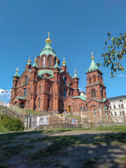 Fototapeta na wymiar The exterior of Uspenski Cathedral in the city center of Helsinki, Finland