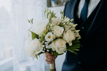 white wedding bouquet in hand
