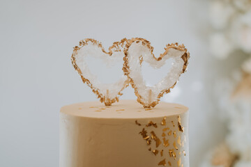 white wedding cake with two hearts