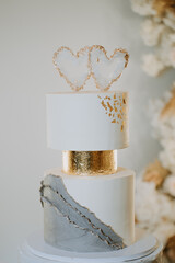 white wedding cake with two hearts
