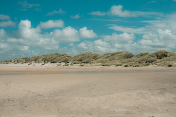 Fototapeta na wymiar sand dunes and clouds