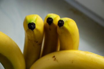  Bunch of ripe yellow bananas rich in vitamins on neutral background.