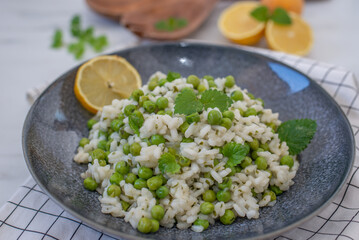 Plate of green pea risotto with green pea