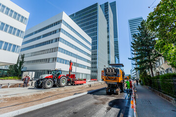 BASEL, SWITZERLAND - July 11 2023: The road service activity near Roche business headquarters, ensuring smooth transportation and timely deliveries for Roche company. - obrazy, fototapety, plakaty