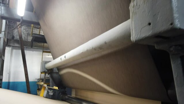 conveyor of a paper-making machine at a paper factory in the production of technical paper for packaging and electrical engineering