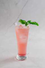 Fresh pink cocktail on a bright background