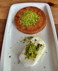 Künefe dessert with icecream in plate.