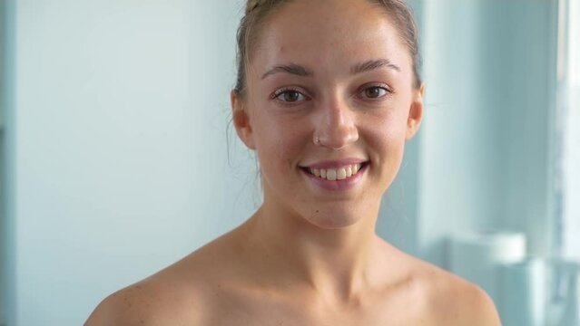 Portrait naked young woman in bathroom at morning smiling before taking shower. Healthy lifestyle and body rejuvenating therapy concept