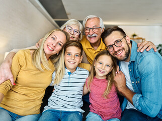 child family portrait woman mother man father grandmother daughter group smiling happy adult girl...