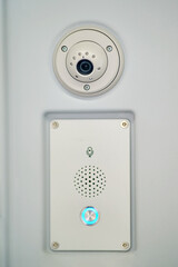 Intercom for passengers with train driver and CCTV camera. Security camera on the wall of a transport
