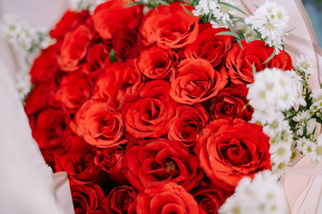 red roses in the form of a bouquet as a sign of proposing to someone he loves