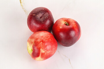 Ripe sweet juicy nectarines heap