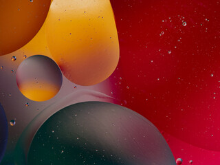 abstract background oil drops on water macro orange