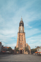 Fototapeta na wymiar Royal Square with the largest tower in the Netherlands in the famous city of Delft. Dutch monuments