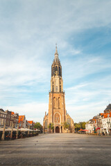 Fototapeta premium Royal Square with the largest tower in the Netherlands in the famous city of Delft. Dutch monuments