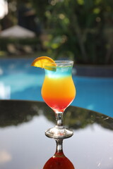 Cocktail near the pool, Alcoholic juice by the pool, Juice by the pool