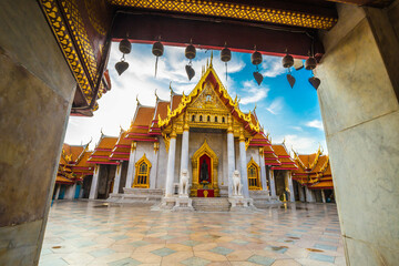Naklejka premium Marble buddha temple with golden pagoda sightseeing travel in Bangkok city