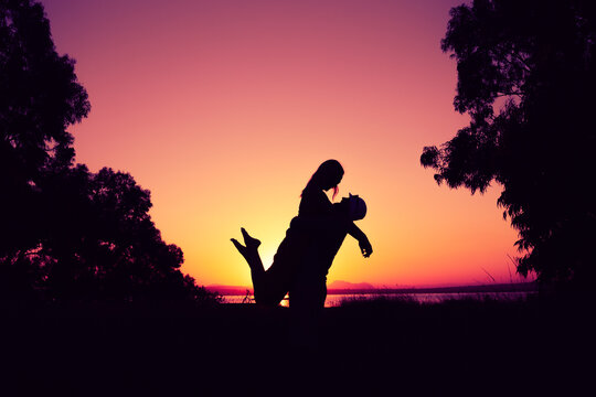 silhouette of a couple in love at sunset against the backdrop of nature. there is a place