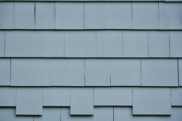 Background of painted gray blue cedar shingle. Exterior wall wood siding. - obrazy, fototapety, plakaty