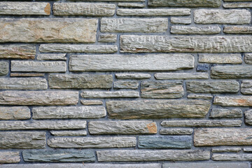 Background of stone wall gray tone. Different shape dimensions gray stone.