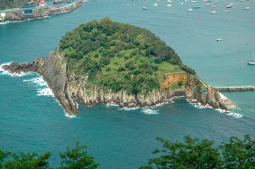 Santa Clara Island, San Sebastian Guipuzcoa Spain.
Aerial view of the islet with the fishing port in the background