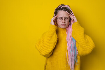 Portrait of woman close eyes and migraine, touching head, feeling dizzy from headache, standing...