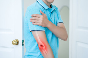 Diseases of the elbow joint, bone fracture and inflammation, man suffering from pain in cubit