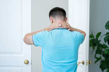 Neck pain, man suffering from ache at home
