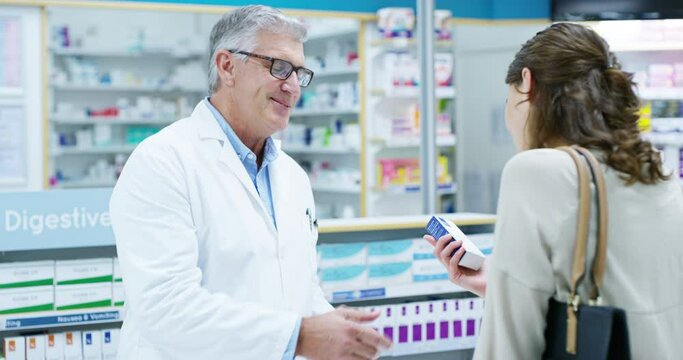 Pharmacist, man and customer in pharmacy with medicine, pills or medication. Healthcare, senior and woman with doctor shopping for drugs, medical product and buying box in retail store with a smile.