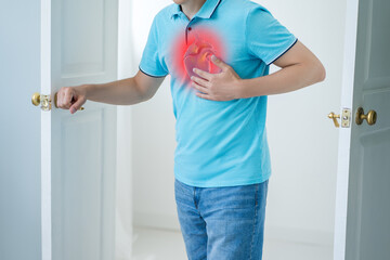 Heart attack, man with chest pain suffering at home, myocardial infarction