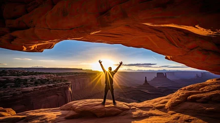 Rolgordijnen Man enjoying sunrise at Mesa arch, Canyonlands national park, © Creative Station